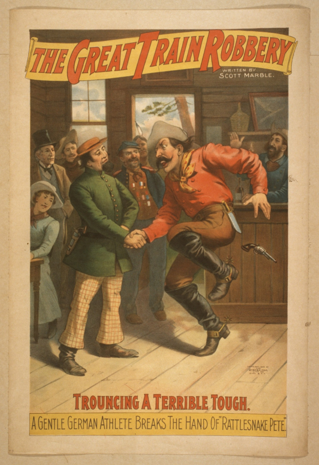 Plakat, das eine Gruppe von Menschen auf einem Boden zeigt, wobei einer eine Waffe hält, ein Fenster und eine Wand im Hintergrund und Text, der "The Great Train Robbery - Trouching a Terrible Tough" an der Ober- und Unterseite liest.